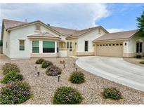 Charming single-story home with a well-manicured desert landscape and a private driveway at 5422 Nestled Moon Ct, Las Vegas, NV 89131