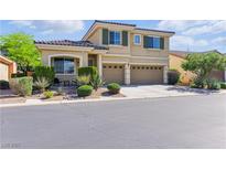 Charming two-story home featuring a landscaped front yard and a two-car garage at 7417 Horizon Rock Ave, Las Vegas, NV 89179