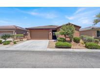 Charming single-story home featuring desert landscaping, tile roof, and inviting curb appeal at 7428 Alamo Ranch Ave, Las Vegas, NV 89179