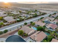 An aerial view of a community highlighting desert landscaping and block wall fenced backyards at 8356 Shady Lady Ct, Las Vegas, NV 89131