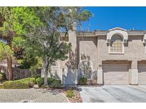 Charming two-story townhome featuring a well-maintained front yard and attached two-car garage at 10159 Tumbling Tree St, Las Vegas, NV 89183