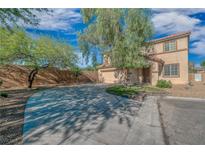 Charming two-story home featuring a spacious driveway and desert landscaping at 11273 Accademia Ct, Las Vegas, NV 89141
