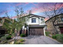 Charming two-story home featuring a two-car garage and well-manicured landscaping at 2332 Mundare Dr, Henderson, NV 89002