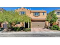 Charming two-story home featuring a two-car garage, well-maintained landscaping, and a welcoming front entrance at 2544 Sable Ridge St, Henderson, NV 89044