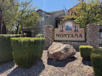 Community entrance featuring a 'Montana' sign surrounded by lush landscaping and decorative stone pillars at 555 E Silverado Ranch Blvd # 2052, Las Vegas, NV 89183
