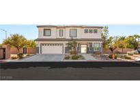 Charming two-story home featuring a well-manicured front yard, desert landscaping, and a two-car garage at 6315 Bellisima St, Las Vegas, NV 89118