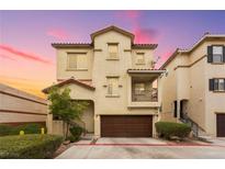 Charming two-story townhome with a well-maintained front yard and attached garage at 6488 Bentley Wood Ct, Las Vegas, NV 89130