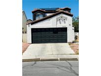 Charming two-story home featuring a spacious two-car garage and low maintenance desert landscaping at 6640 Crosstimber Ct, Las Vegas, NV 89108