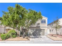 Charming two-story home featuring stucco siding, mature landscaping, and an attached two-car garage at 6649 Maple Mesa St, North Las Vegas, NV 89084