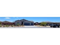 Charming single-story home with a low maintenance front yard at 73 Hawk Ave, Pahrump, NV 89060