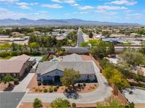 Expansive aerial view of a single-Gathering home showcasing desert landscape and mountain views at 8125 Soledad Canyon St, Las Vegas, NV 89131