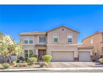 Charming two-story home boasts a tile roof, three-car garage, and manicured landscaping, creating inviting curb appeal at 1213 High Altitude Ave, North Las Vegas, NV 89032