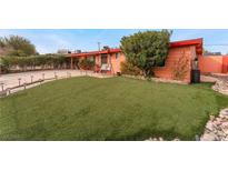 Charming home featuring an inviting front yard, with a well-manicured lawn and lovely landscaping at 147 Cervantes St, Las Vegas, NV 89101
