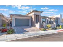 Charming single-story home with a two-car garage and manicured landscaping at 421 Point Sur Ave, Las Vegas, NV 89138