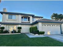 Charming two-story home with manicured lawn and attached two car garage at , Las Vegas, NV 89117