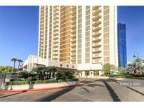 Contemporary high-rise features a valet area and meticulously landscaped grounds with palm trees at 135 E Harmon Ave # 1102, Las Vegas, NV 89109