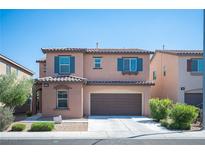 Inviting two-story home featuring a charming facade, well-maintained landscaping, and a convenient two-car garage at 1405 Gilbert Creek Ave, North Las Vegas, NV 89031