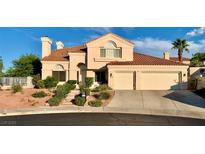 Charming two-story home featuring a tile roof, desert landscaping, and a spacious two-car garage at 1915 Hazeltine Ct, Henderson, NV 89074