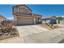 Charming two-story home with desert landscaping, attached garage, and separate garage in back at 2341 Steinke Ln, Las Vegas, NV 89108