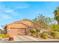 Charming single-story home featuring a well-maintained front yard and a two-car garage at 2720 Mickey Mantle Ct, Las Vegas, NV 89108