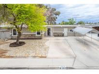 Charming single-story home features stone accents, mature landscaping, and a covered parking area at 2819 Taylor Ave, North Las Vegas, NV 89030