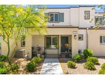 Charming townhome featuring a welcoming front porch and well-maintained landscaping at 3518 Herodain Ave, Las Vegas, NV 89106