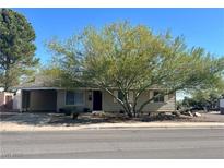Charming single-story home with a well-maintained front yard and mature tree providing ample shade at 429 Scenic Dr, Henderson, NV 89002