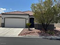 Charming single-story home features a well-maintained front yard and a spacious two-car garage at 8325 Aspen Village St, Las Vegas, NV 89113