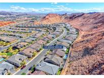 Beautiful aerial view of a desert neighborhood with mountain views in the background at 125 Mirage View Dr, Henderson, NV 89011