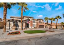 Stunning two-story home featuring a circular lawn, fountain, and palm trees creating an inviting curb appeal at 1316 Eagle Meadow Ct, Las Vegas, NV 89123