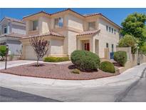 Charming two-story stucco home with a red tile roof and a well-maintained xeriscaped front yard at 1812 Relate Ct, Las Vegas, NV 89117