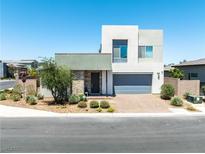 Contemporary two-story home with a well-manicured xeriscaped front yard and a two car garage at 4246 W Landberg Ave, Las Vegas, NV 89141
