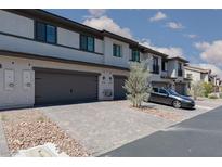Charming townhomes featuring private garages and modern architecture at 835 Jigglypuff Pl, Henderson, NV 89011