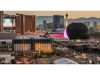 Las Vegas skyline view featuring hotels, casinos, and the Sphere at dusk with a mountainous backdrop at 125 E Harmon Ave # 321, Las Vegas, NV 89109