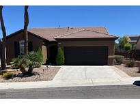 Charming single-story home featuring a well-maintained yard and a two-car garage at 2158 Alyssa Jade Dr, Henderson, NV 89052