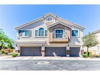 Inviting townhome with a private balcony and three-car garage in a desirable neighborhood at 2264 Steamers Ave # 102, Las Vegas, NV 89183