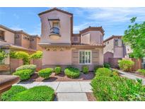 Charming two-story home with a red tile roof, a small balcony, and well-maintained landscaping at 2432 Granada Bluff Ct, Las Vegas, NV 89135
