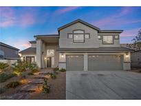 Charming two-story home with a landscaped yard and a three-car garage at 2647 Hourglass Dr, Henderson, NV 89052