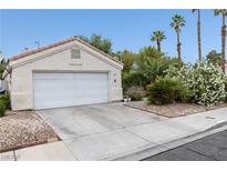 Single-Gathering home with a two-car garage, low-maintenance landscaping, and a traditional-style roofline at 2837 Du Barry Manor Ln, Las Vegas, NV 89108