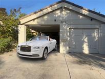 Exterior of a charming home featuring a carport, garage, and a luxurious white convertible at 2989 Bel Air Dr, Las Vegas, NV 89109