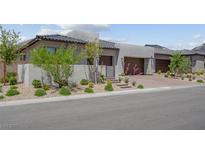 Beautiful single-story home with a three-car garage and desert landscaping at 313 Forsyth Park St, Las Vegas, NV 89138