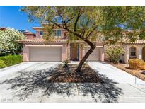 Charming two-story home featuring a tile roof, stone accents, and a two-car garage at 3408 Livia Ave, North Las Vegas, NV 89031