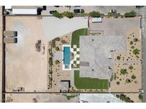 Expansive property featuring a large pool, patio, and extensive landscaping, all enclosed within a secure perimeter fence at 3955 W Jo Rae Ave, Las Vegas, NV 89141