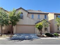 Charming two-story home featuring a two-car garage, well-maintained landscaping, and classic architecture at 5055 Lime Kiln Ave, Las Vegas, NV 89139
