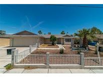 Charming single-story home with desert landscaping and a white fence at 5170 S Pearl St, Las Vegas, NV 89120