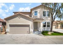 Charming stucco two-story home with a two car garage and a well kept yard at 529 Fork Mesa Ct, Henderson, NV 89015