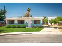 Charming single-story home featuring a well-manicured lawn and freshly painted exterior at 6121 Iris Cir, Las Vegas, NV 89107
