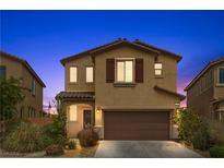 Charming two-story home with a two-car garage and well-maintained landscaping at 6354 Point Isabel Way, Las Vegas, NV 89122