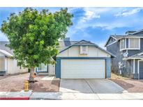 Charming single-story home with a well-maintained lawn and two-car garage at 824 Schooner Dr, Henderson, NV 89015