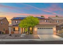Two-story home features a neutral color scheme, large garage, and solar panels at 8723 Melissa Meadows St, Las Vegas, NV 89131